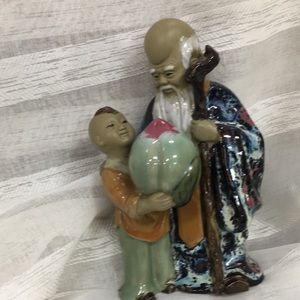 Asian figurine wise man and child